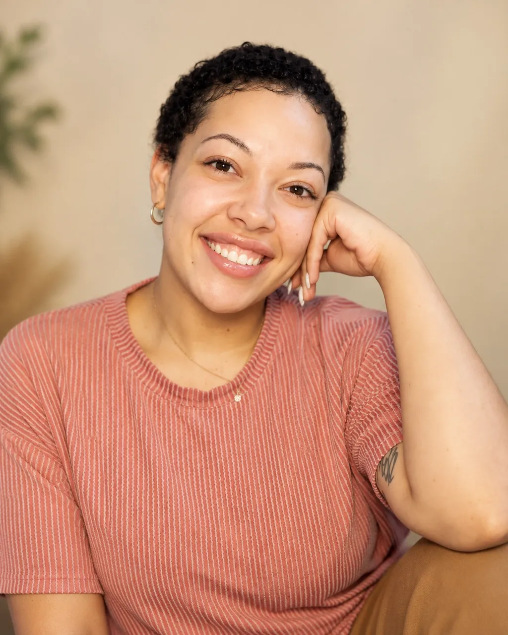Makayla Askew smiling in a blush striped shirt